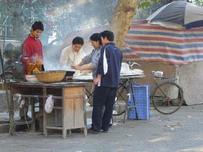 Family-run youtiao street stall in Nanjing on a bright morning